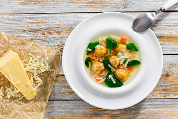 wedding soup with meatballs, small pasta risini,spinach and vege