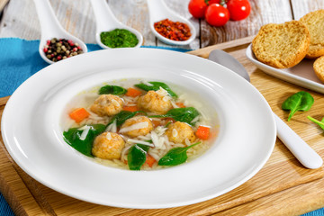 delicious wedding soup with meatball, carrots and spinach