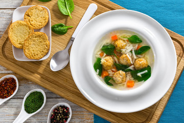 delicious wedding soup with meatball, carrots and spinach