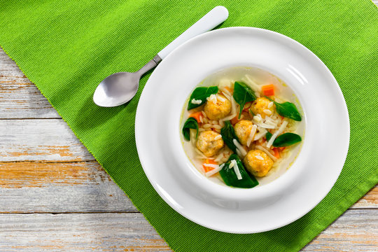 wedding soup with meatballs, small pasta risini,spinach and vege