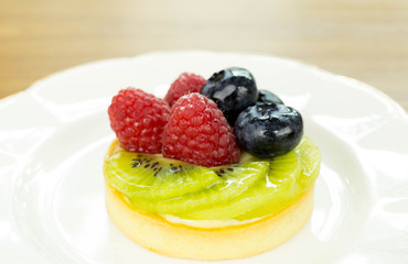 Fresh fruit pie tart with kiwi, blueberry, and raspberry  and ra