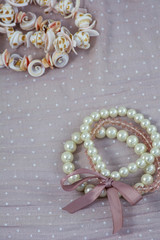 Several light and pink wristbands on the pink background