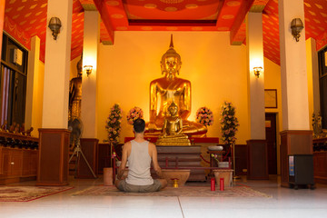 Nov 27 ,2016 : AT Wat Sraket Rajavaravihara , Unidentified man meditating in front of buddha statue in temple
