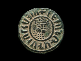 Ancient copper armenian coin with ruler portrait isolated on black