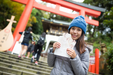 Asian Woman holding famous cracker in kamakura city