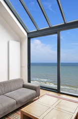 Fototapeta na wymiar Modern living room with large windows