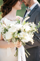 wedding couple hugging outdoors