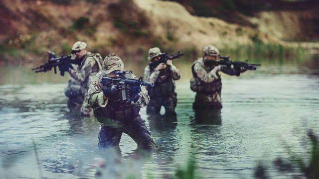 special forces soldiers with weapon take part in military maneuv