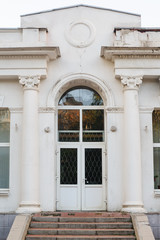 White facade with doors and columns