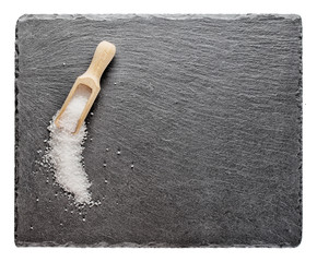 Salt with wooden spoon on slate blackboard © alexlukin
