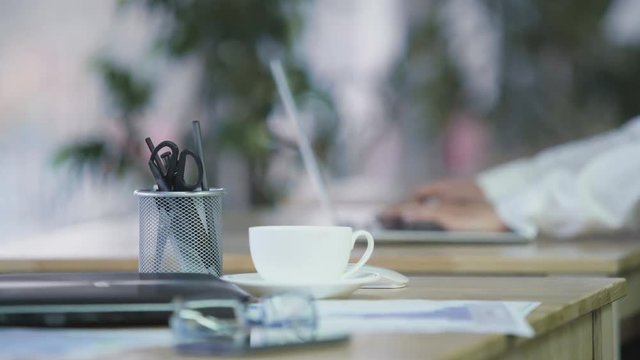 Female working on laptop at office, responsible worker, workplace, refocus