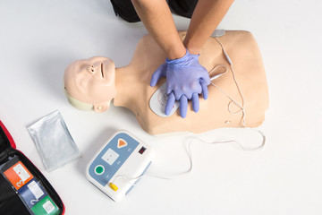 Paramedic demonstrate Cardiopulmonary resuscitation (CPR) on  dumm
