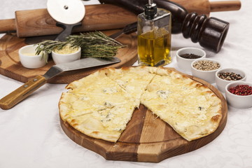 Pizza with at and set different peppers