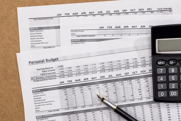 Personal Budget with pen and calculator. Finance Concept.