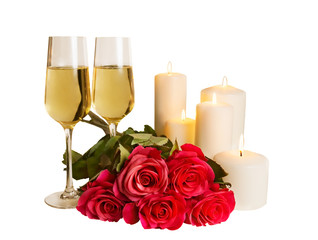 Champagne, roses and candles isolated on white background