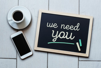 Chalkboard or Blackboard concept saying - We need you