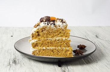Carrot cake with cream cheese, nuts, berries and tangerines