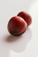 plum fruit whole on a light background closeup