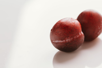 plum fruit whole on a light background closeup