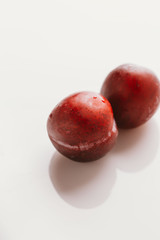 plum fruit whole on a light background closeup