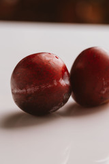 plum fruit whole on a light background closeup