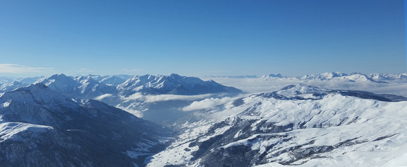 Fototapeta na wymiar Views across the Zermatt Glacier and ski resort and high Switzerland alpine peaks