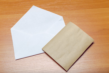 Photo of blank envelope on a  wooden background