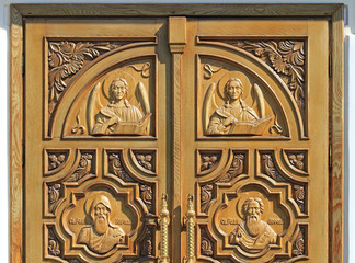 carved well decorated door in orthodox church