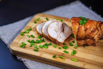 chicken roll on a board, pastrami meat, sausage house