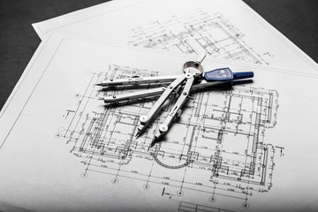 Construction planning drawings on black background
