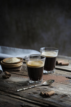 Glasses of espresso on rustic table
