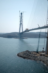 Construction of the cable-stayed bridge. Cable-stayed pylon in foreground