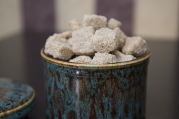 Brown cane sugar is the sugar bowl.