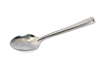 Stainless steel glossy metal kitchen spoon isolated over the white background