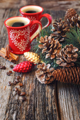Two cup of coffee, pine cones and New-Year decorations