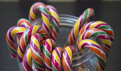 Colored licorice sticks in jar.