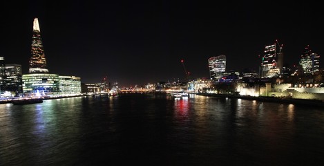 Fototapeta na wymiar London riverside panorama at night seen from Tower Bridge