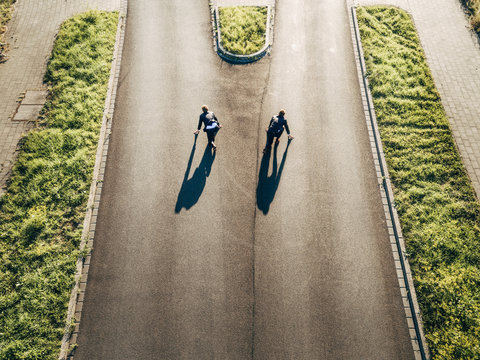 Two businessmen starting race on road