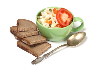 Porcelain plate with vegetable soup on white background