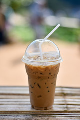 ice coffee on a wood with nature background