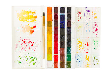 Artistic watercolor paint and brush in plastic box with palette