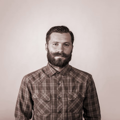 portrait of a young man with a beard and mustache