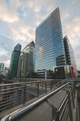 Fototapeta na wymiar the road to the entry modern high-rise buildings