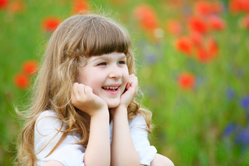 cute smiling little girl portrait close-up outdoors