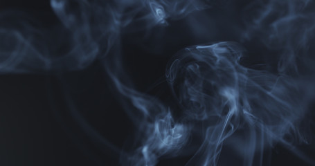 mystery blue smoke over dark background