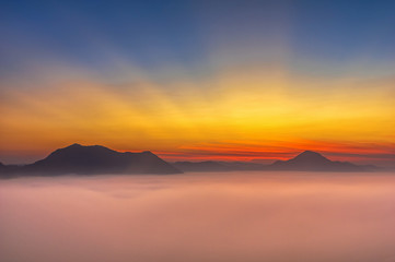 Fototapeta na wymiar Fantastic Landscape of Misty Mountain with sun rays over Phu Tho