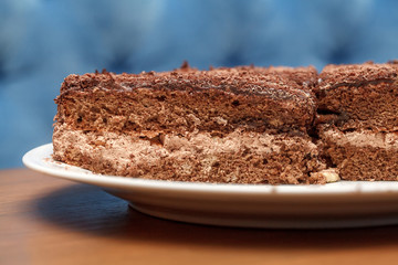 Slices of chocolate cake with cream closeup