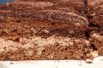 Slices of chocolate cake with cream closeup