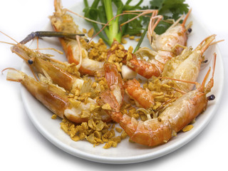 Prawn lobster or shrimp fried with garlic and vegetables.
