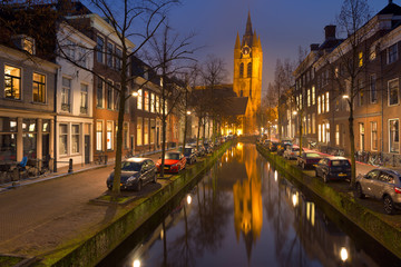 Fototapeta na wymiar Church reflected in a canal in Delft, The Netherlands
